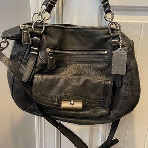 Coach shoulder and/or crossbody body. Gently used. Color is a metallic black.